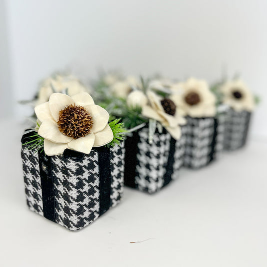 Black and white giftbox ornament with ivory wooden flower. 