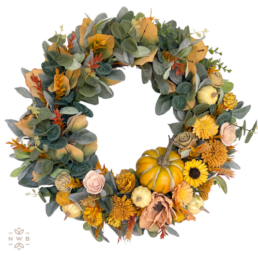 Green, yellow, and gold wooden leaves wreath with handcrafted florals and pumpkin decoration. 