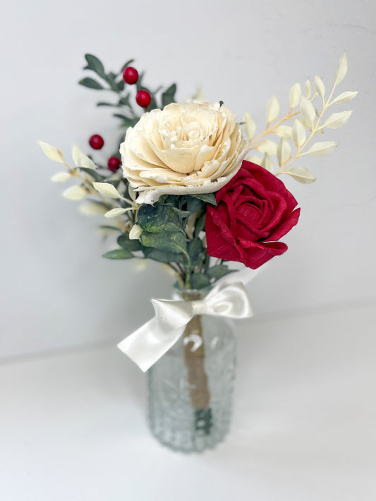 Ivory and red wooden rose bouquet in clear vase with decorative whtie glossy bow.