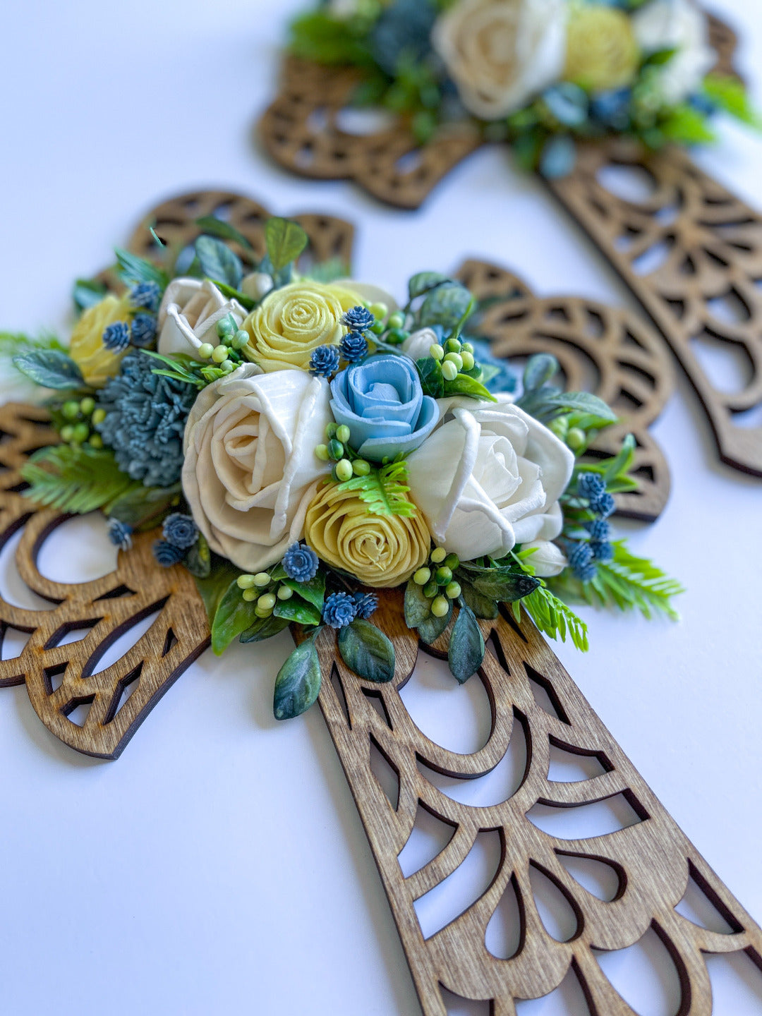 16 inch ornate cross with handcrafted blue, yellow, and ivory customized florals