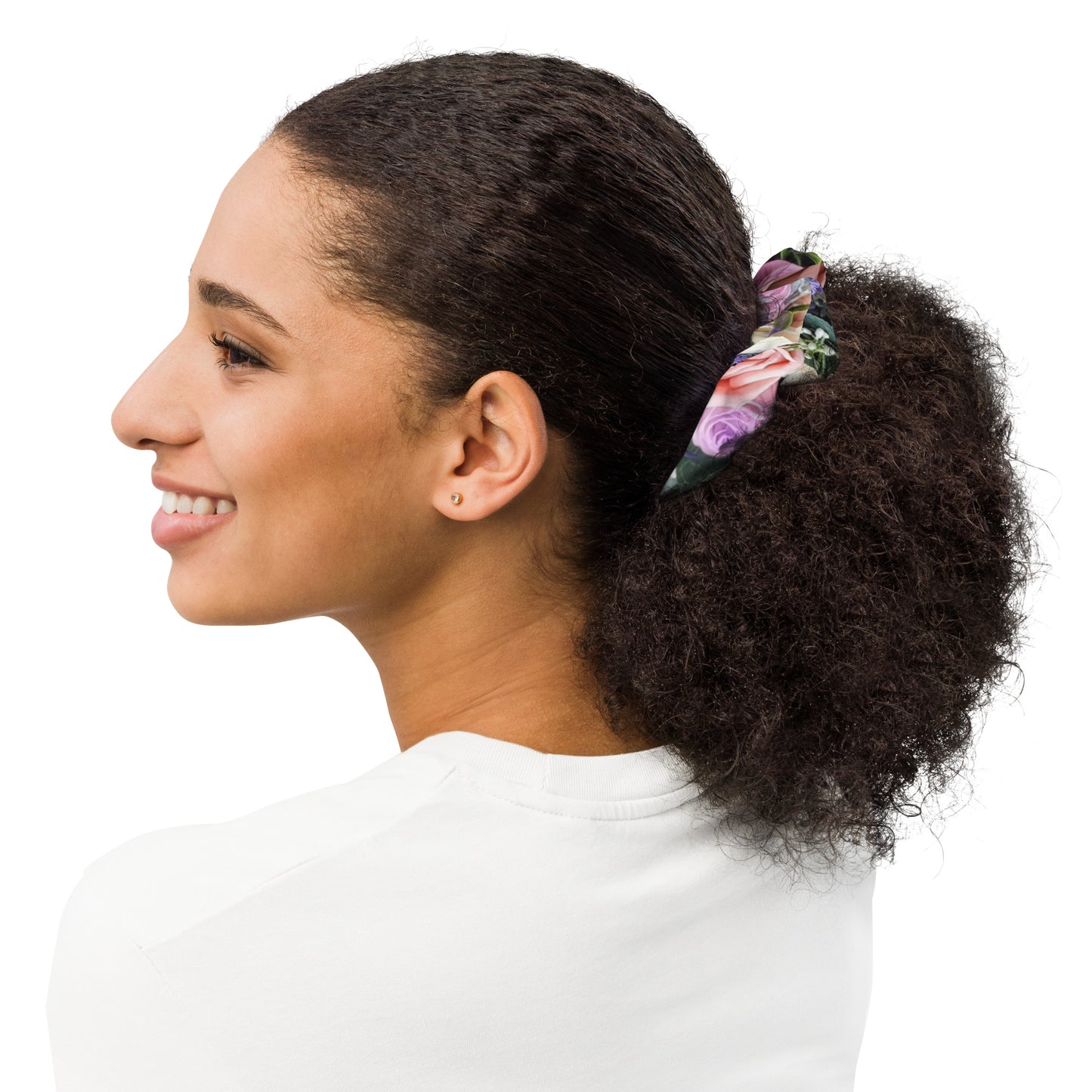 Multicolored floral hair scrunchie with pink, purple, and green flowers.