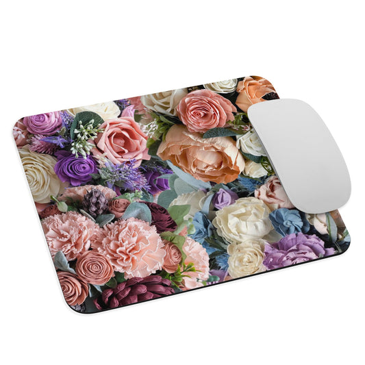 Pink, ivory, purple, and blue floral designed mouse pad for computer. 