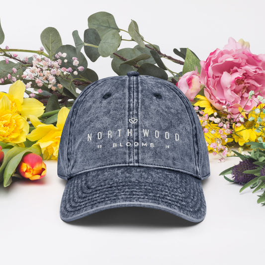 Vintage navy blue cap with "North Wood Blooms" written in white print.  